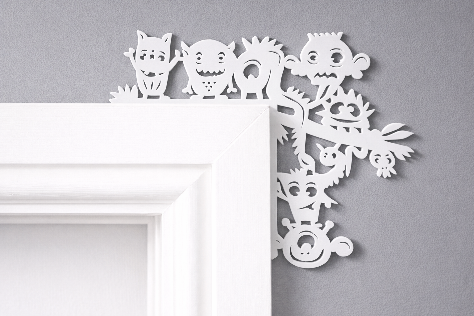 Monster door corner decoration made from acrylic, displayed on a door frame in a child’s bedroom or playroom.
