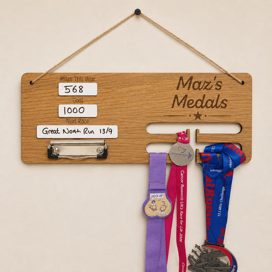 Personalised running medal holder displaying race medals, running bib and reusable dry wipe mileage tracker handmade from oak veneer