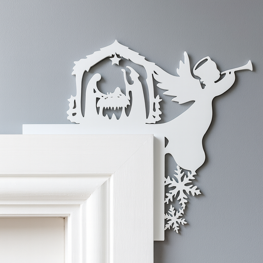 Decorative wall art with an angel playing a trumpet and a nativity scene on a gray background.