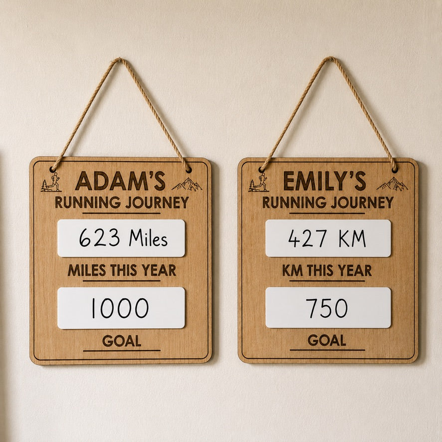 Personalised running goal tracker displayed on wooden stand with miles tracker and running motivation board